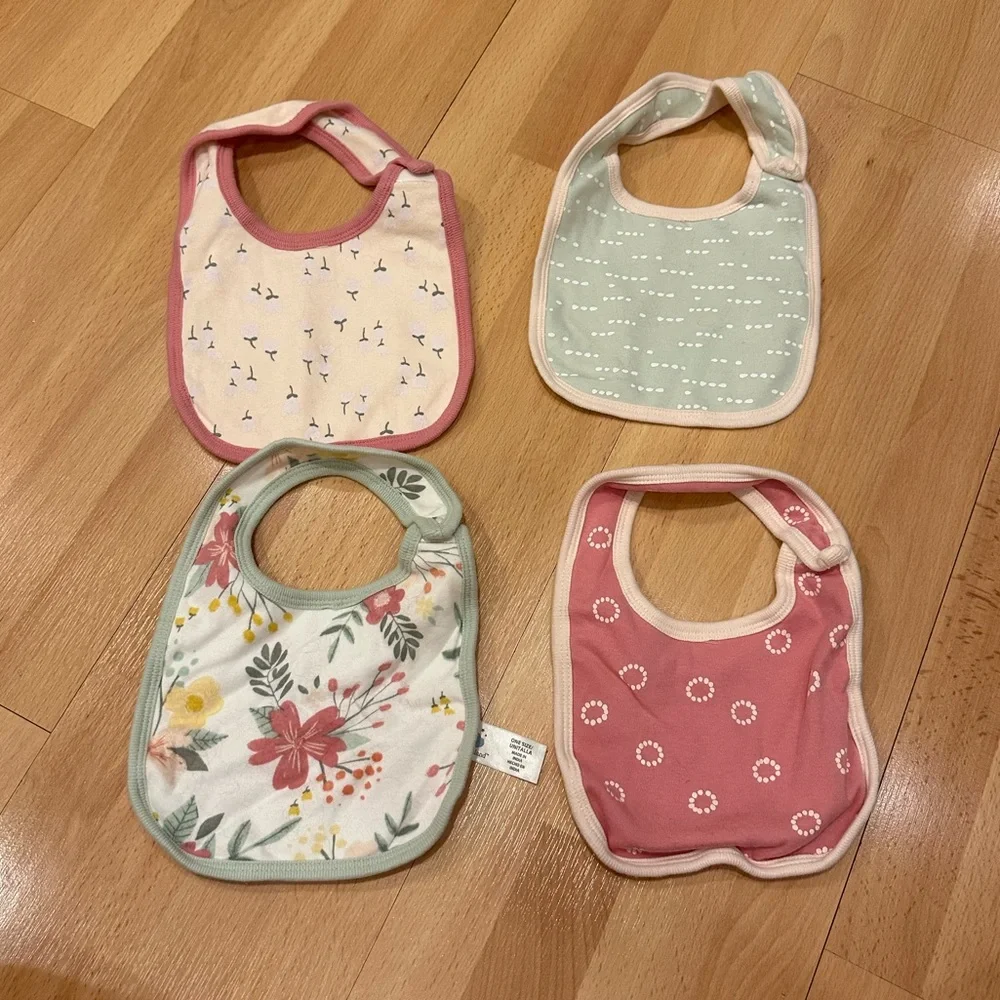 Set of four girls patterned cloud island bibs